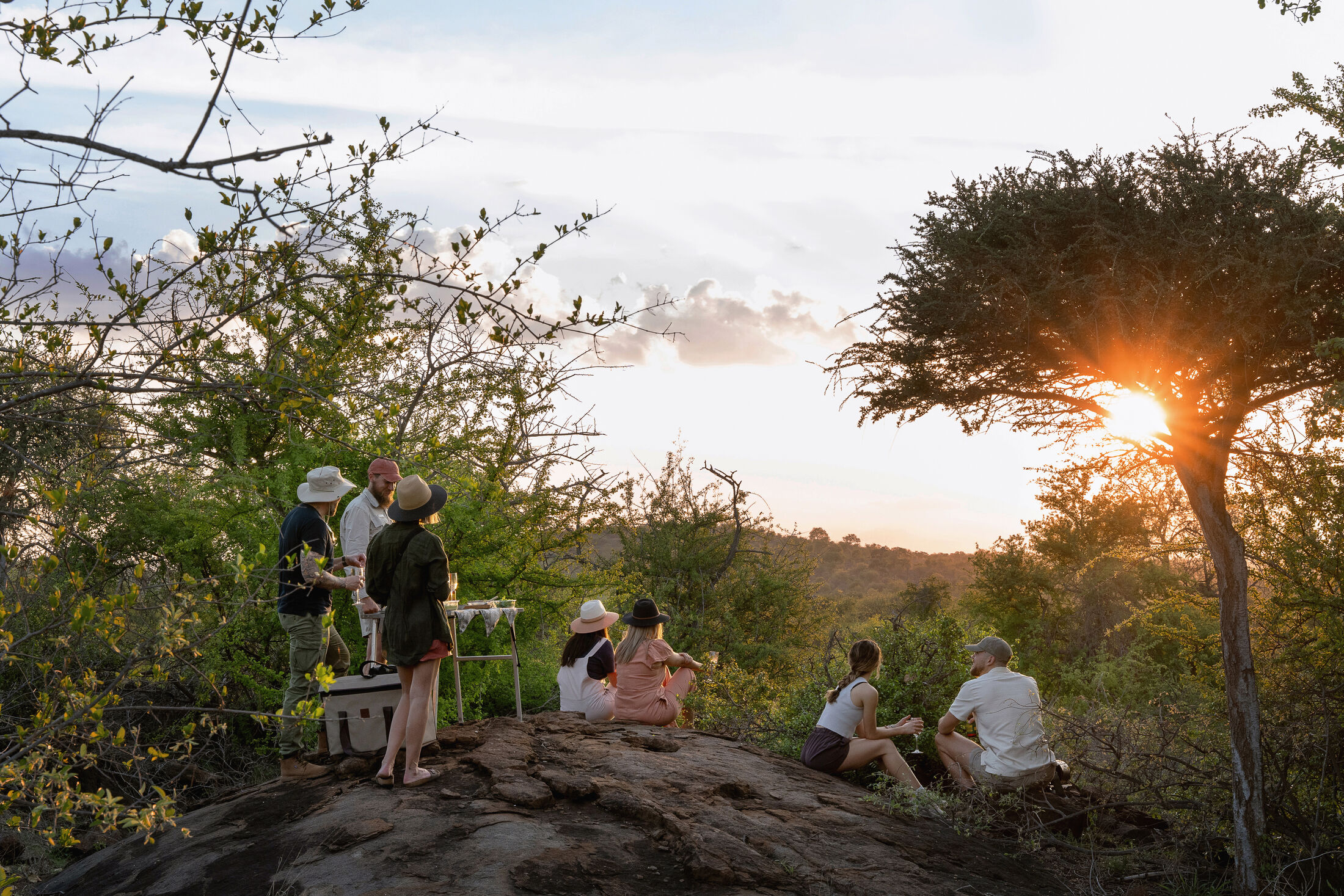 Sundowner drinks at sunset in the African wilderness